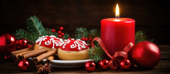 Aufkleber - Festive Christmas cookies with red candle and decorative holiday elements on a wooden table setting for seasonal celebration.