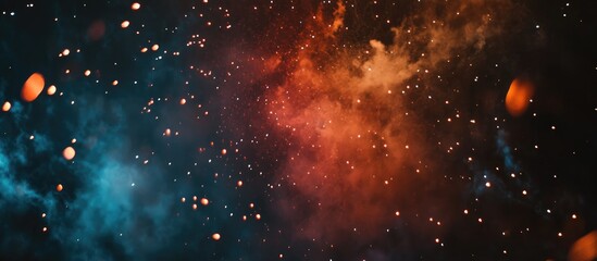 Poster - Vibrant display of red orange and blue fireworks illuminating a dark night sky filled with colorful bursts and sparkling lights