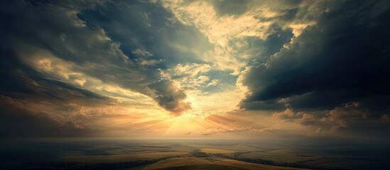 Poster - Majestic landscape with dramatic clouds and sunlight illuminating the horizon during a serene sunset in a scenic natural environment
