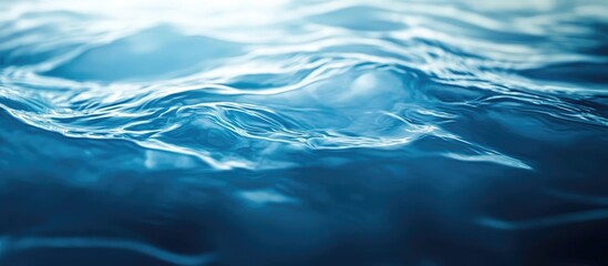 Poster - Natural ocean water texture with subtle swirling patterns creating a serene underwater luminescent background ideal for artistic designs.