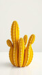 © Andaman - Artistic image of yellow cactus against white table, bright, against, aesthetic