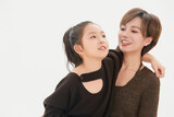 Beautiful mother and cute daughter portrait on white background