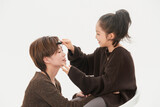 Beautiful mother and cute daughter portrait on white background