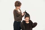 Beautiful mother and cute daughter portrait on white background