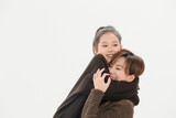Beautiful mother and cute daughter portrait on white background