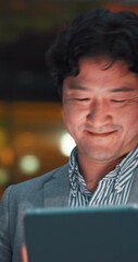 Poster - Happy, night and Asian man on tablet in city for communication, typing email and networking. Professional, corporate and person on digital tech for contact, online website and internet notification