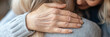 © laddawan - The image captures elderly hands embracing in a heartwarming hug, symbolizing deep bonds, affection, care, and love in life’s precious intimate moments.