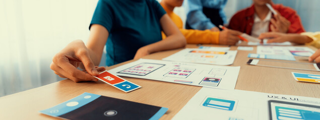 Poster - panorama banner of startup company employee planning on user interface prototype for mobile applicat