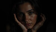 © Dolgren - Artistic Close-Up Portrait of a Thoughtful Young Woman with Hands Framing Her Face in Moody Low-Key Lighting and Deep Shadows