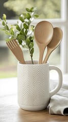 Wall Mural - Creative display of wooden kitchen utensils in a stylish chevron-patterned mug for a modern kitchen ambiance