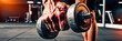 © tanya78 - hand of a strong muscular man with a dumbbell in a gym