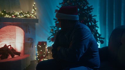 Wall Mural - Cold Man On Sofa Warms Up By The Fireplace On Christmas Eve Night Room