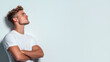 © ArtShop - A man with a white shirt and short hair is standing in front of a white wall