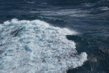 Wall Mural - majestic ocean waves crashing against each other create stunning seascape. deep blue water contrasts