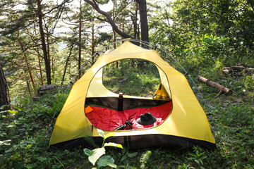 modern camping tent in forest at summer