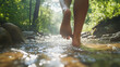 © Michael - Woman embracing the tranquility of a forest stream, strolling barefoot and connecting with nature