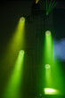 © marketanovakova - Green light of four reflectors and green laser in dark on construction