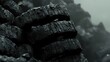© Asraf - Stacked Old Tires with a Grungy Texture Against a Mysterious Foggy Background, Perfect for Environmental, Industrial, and Grunge Themes in Stock Photography