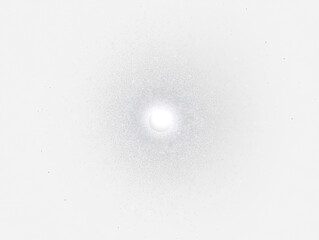 Aufkleber - Bright central light surrounded by radiating particles in dark space.
