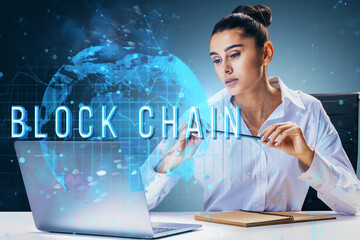 Poster - Woman working on blockchain technology, analyzing data on laptop with holographic globe and blockchain text in the background.