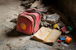 © Ram - A torn school bag and worn-out book in a dilapidated setting, symbolizing lost education, poverty, and abandoned childhood dreams amidst hardship