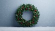 © Morninghead - A festive green holly wreath adorned with red berries and golden ornaments, perfect for holiday decoration.