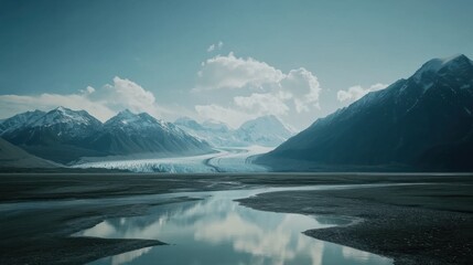 Poster - A tranquil view of the Wrangell-St Elias National Park showcasing glacial landscapes and calm reflective waters under a cloudy sky