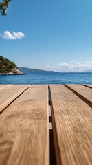 Poster - A wooden table with a view of the ocean