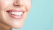 © InfinityArtCreator - Beautiful Smile with White Teeth Against Soft Blue Background