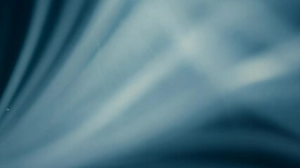 Wall Mural - abstract blue light stream: an ethereal and captivating photograph of an abstract blue light stream.