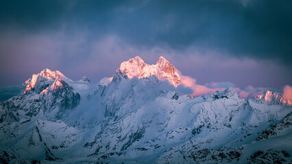 Wall Mural - Mount Ushba. Beautiful snowy mountain peaks at sunset