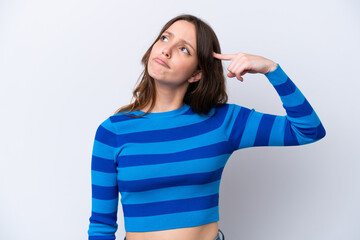 Wall Mural - Young caucasian woman isolated on white background making the gesture of madness putting finger on the head