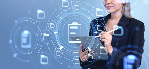 Poster - Businesswoman managing digital documents using a tablet in a fut