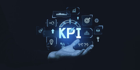Poster - KPI concept with icons representing key business strategies and performance indicators in a futuristic, glowing blue interface on dark background.