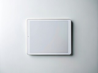 Poster - Minimalist Photography of a Digital Tablet with a Blank White Display on a Clean White Surface, Ideal for Mockups and Presentations in Modern Design Contexts