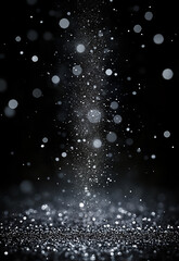 Wall Mural - shimmering silver sparkles on a dark background create a mesmerizing texture. soft blue lights creat