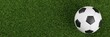 © Shawn Hempel - Soccer ball on green lawn or grass background wide banner with copy space, flat lay top view from above