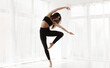 © Prostock-studio - Gorgeous Lady Dancing Contemp and Ballet In Modern Studio. Free Space for text