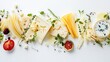 © Pichapob - Assorted Cheeses and Fresh Herbs with Fruits on White Background