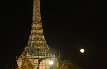 Wall Mural - full moon floating on sky behind bangkok city pillar shrine travel location and landmark in thailand