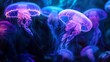 © pattaphorn - A mesmerizing underwater scene featuring glowing jellyfish illuminated in vibrant shades of blue and purple, drifting gracefully through the water.