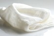 © Hafiz - Blank white bandana folded with cotton texture visible, captured using macro lens on soft box lighting, with copy space