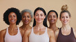 © Nataliya - Portrait of Fit Multiethnic Women in Sportswear Against Beige Background