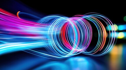 Wall Mural - Colorful light trails creating dynamic circular patterns on a dark background.