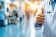 © Abdul - Confident Doctor in White Coat Giving Thumbs Up