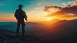 © Kitta Studio - Silhouette of a Soldier Standing at Sunrise on a Mountain Peak with Vibrant Colors of Dawn and Scenic Landscape in the Background