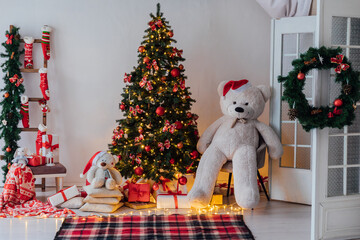 Wall Mural - Christmas Tree With Gifts Decorated With Garlands Toys Interior For New Year