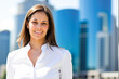 © Minerva Studio - Young businesswoman smiling with office buildings in background