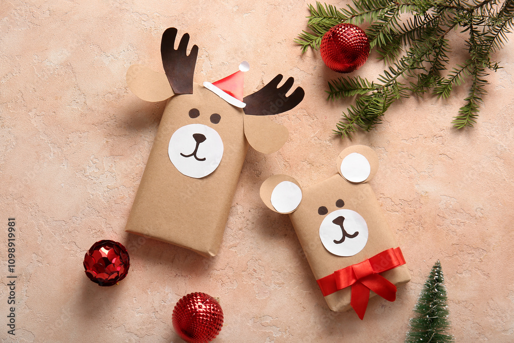 Beautiful composition with present boxes, fir branch and Christmas balls on pink grunge background