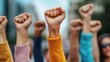 © khonkangrua - Empowering protest with raised fists symbolizing unity, strength, and a collective demand for change amidst a dynamic urban backdrop filled with motivation and resilience.